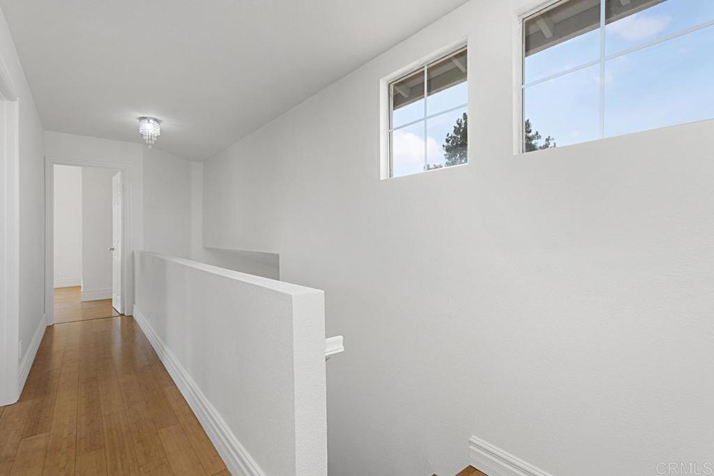 27611 Marian Road Temecula, CA 92591 - Photo 6 of 13 a view of a hallway with wooden floor