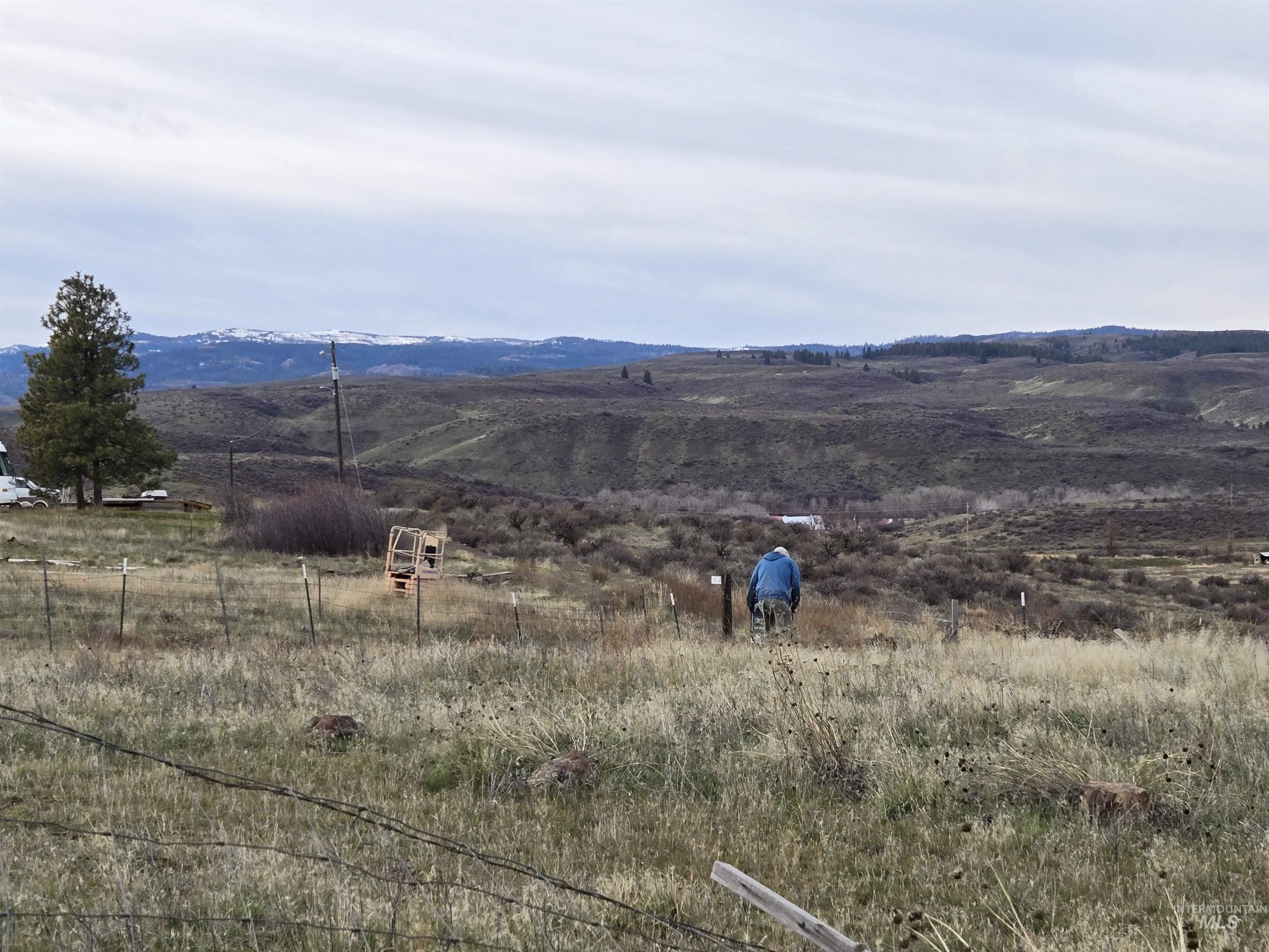 95 Council Id 83612 Council, ID 83612 - Photo 11 of 11 Open Idaho acreage with rolling to sloped hills, native sage, and long-range views. A survey marker visible on-site help identify boundaries. A peaceful setting with great potential for grazing, recreation, or a future homesite.