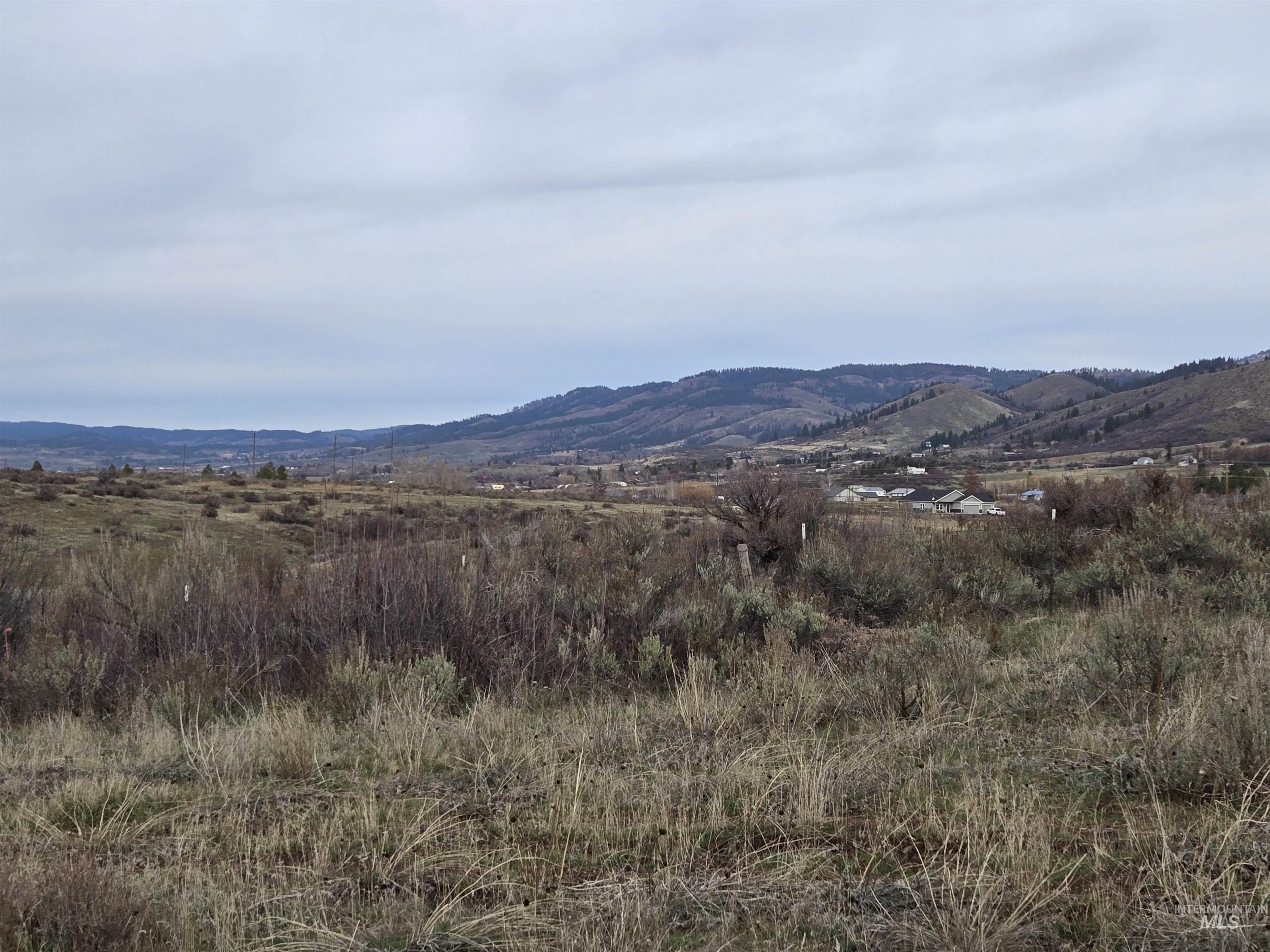 95 Council Id 83612 Council, ID 83612 - Photo 9 of 11 Open Idaho landscape with rolling to sloped hills, native sage, and valley views stretching into the distance. A quiet setting with room to roam—ideal for grazing, recreation, or planning your future homesite.