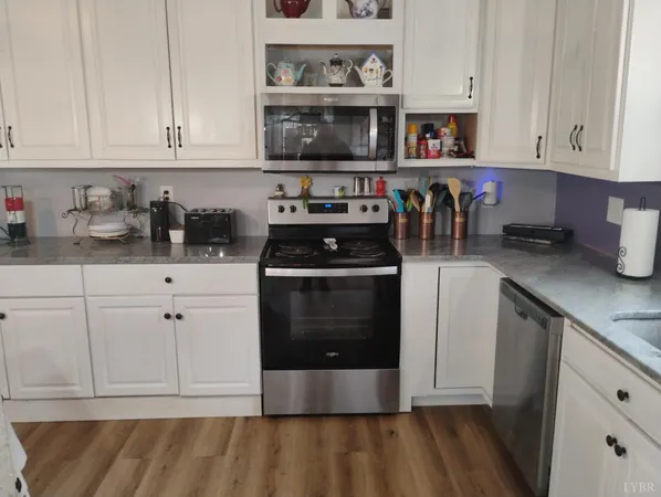 a workspace with furniture and wooden floor
