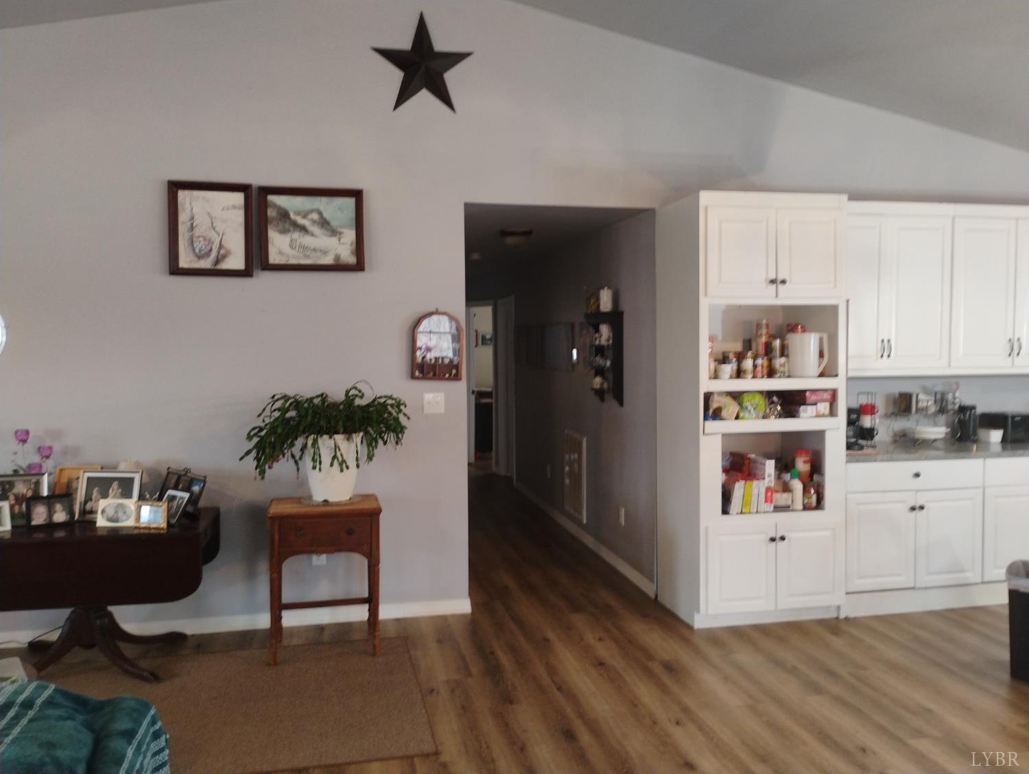 4183 Tye River Road Amherst, VA 24521 - Photo 16 of 62 a living room with kitchen island furniture and a kitchen view