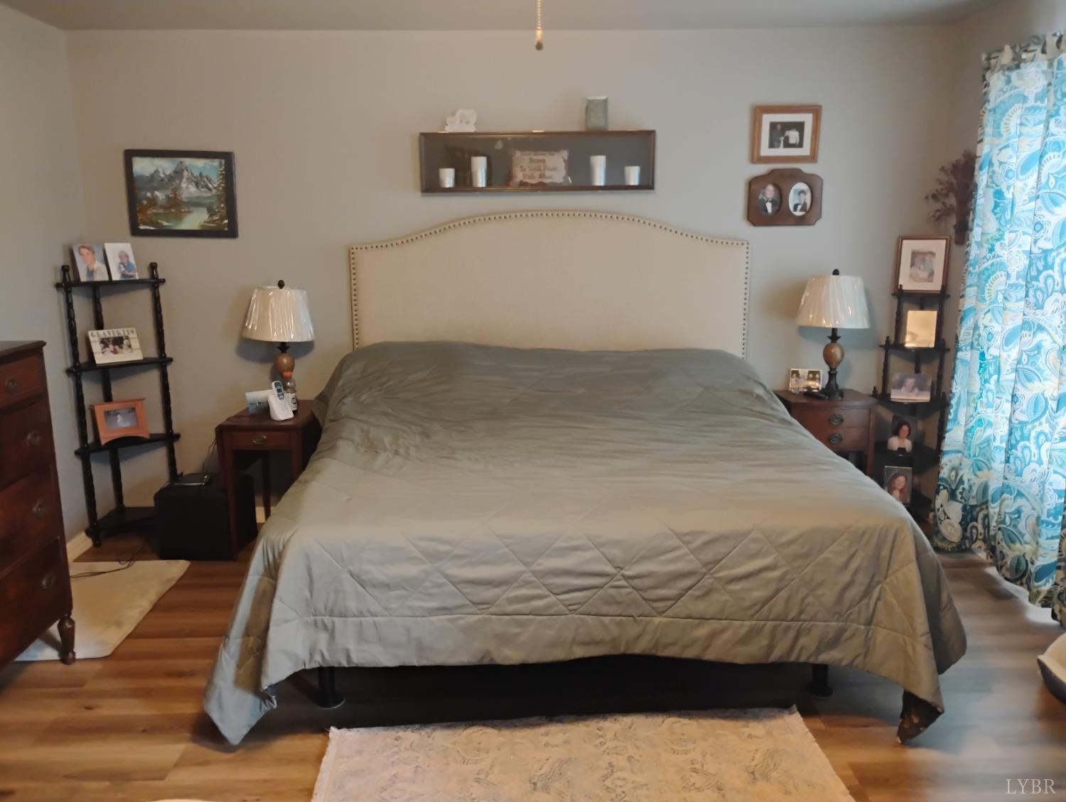 4183 Tye River Road Amherst, VA 24521 - Photo 18 of 62 a bedroom with a bed and a lamp
