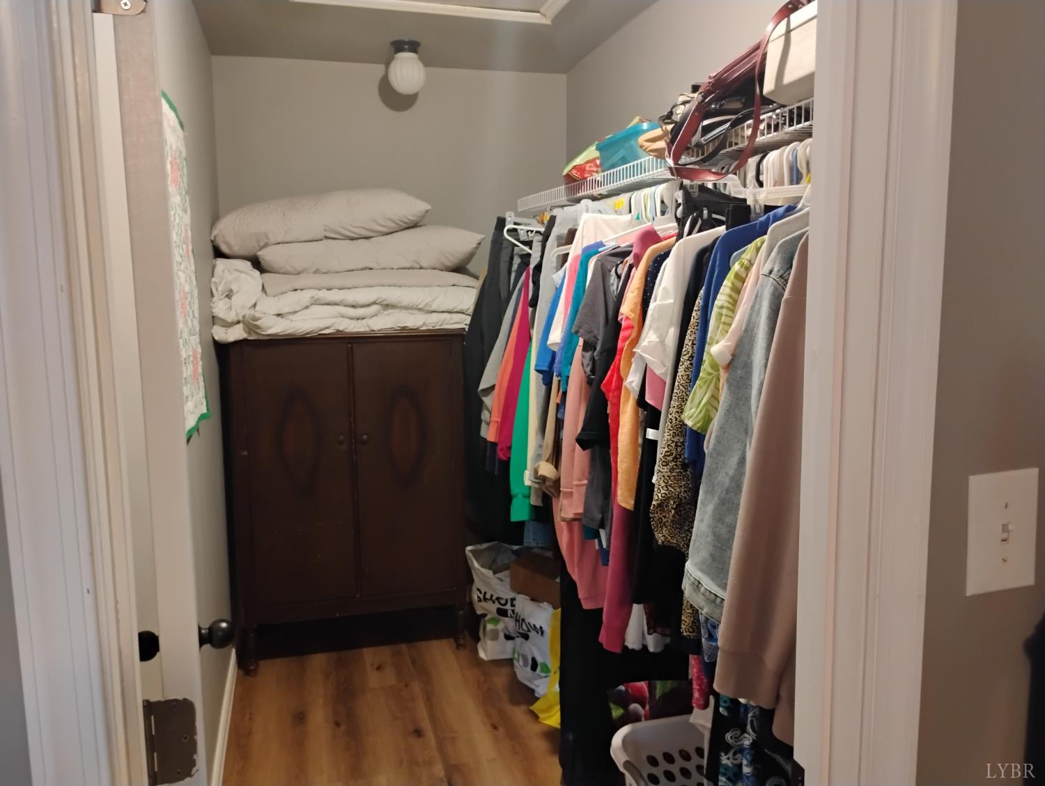 4183 Tye River Road Amherst, VA 24521 - Photo 20 of 62 a view of walk in closet with clothes and shoes