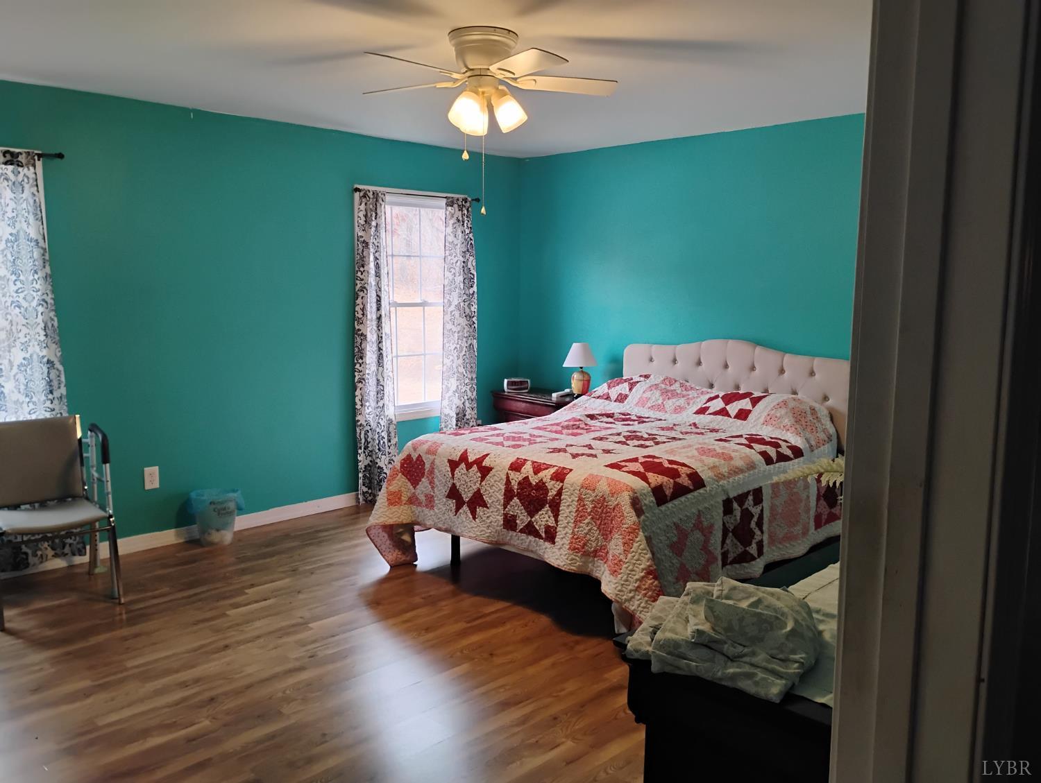 4183 Tye River Road Amherst, VA 24521 - Photo 30 of 62 a bed sitting in a bedroom next to a window