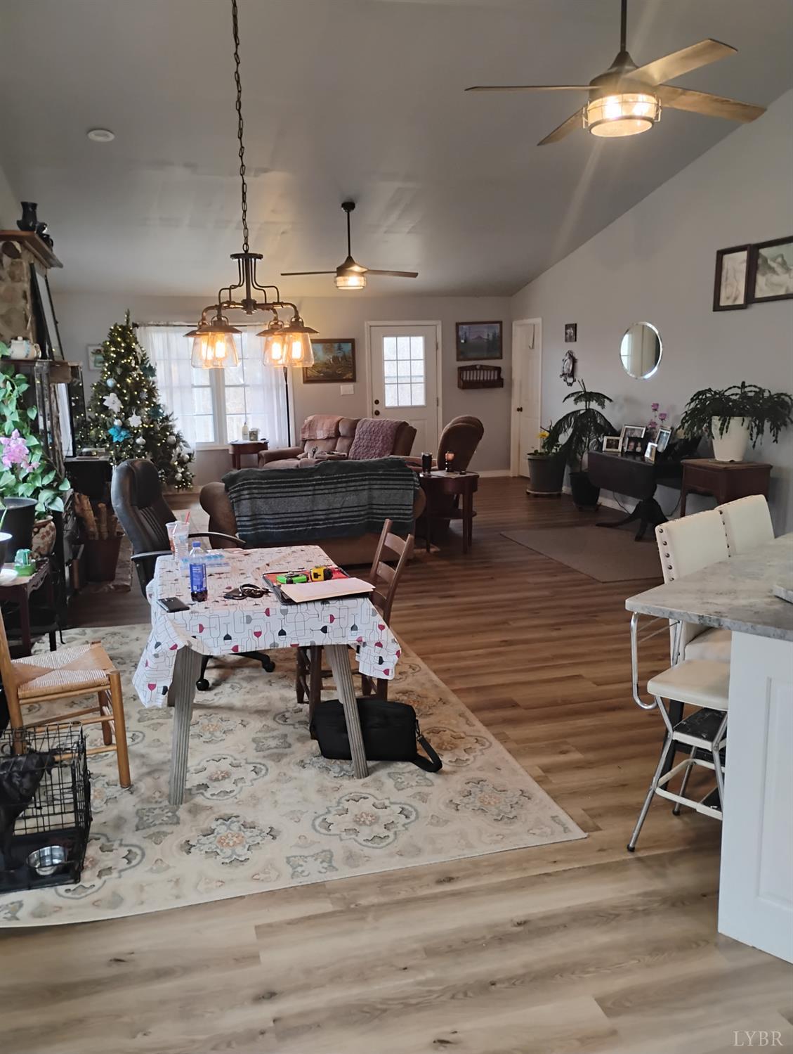 4183 Tye River Road Amherst, VA 24521 - Photo 10 of 62 a living room with furniture and a chandelier