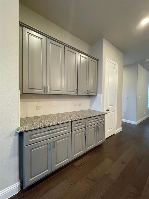 2401 Springhill Avenue Flower Mound, TX 75028 - Photo 11 of 27 a kitchen with granite countertop cabinets stainless steel appliances and a sink