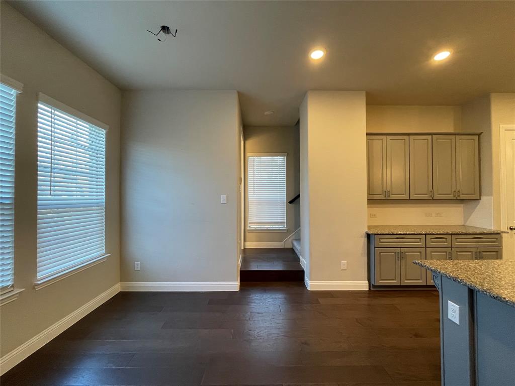 2401 Springhill Avenue Flower Mound, TX 75028 - Photo 13 of 27 a view of a refrigerator in kitchen and wooden floor