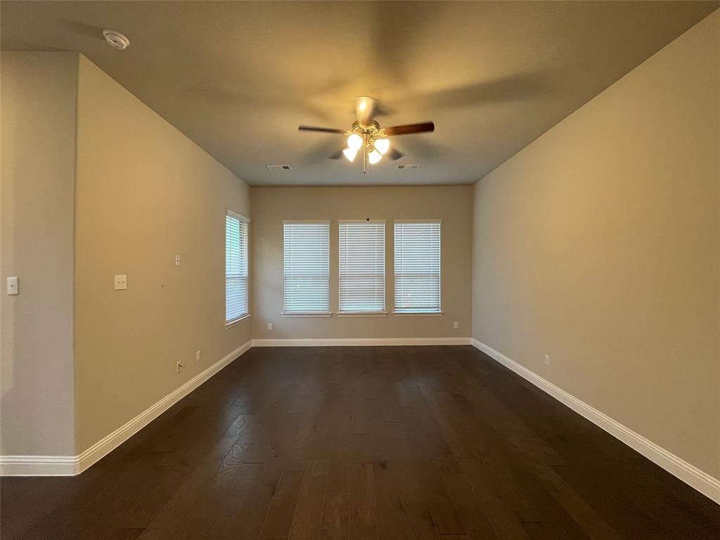 2401 Springhill Avenue Flower Mound, TX 75028 - Photo 14 of 27 a view of an empty room with chandelier fan and a window