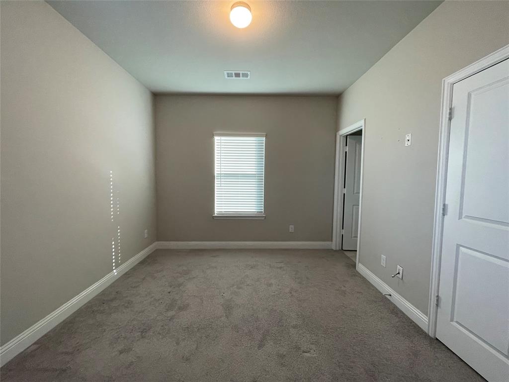 2401 Springhill Avenue Flower Mound, TX 75028 - Photo 16 of 27 a view of an empty room with a window