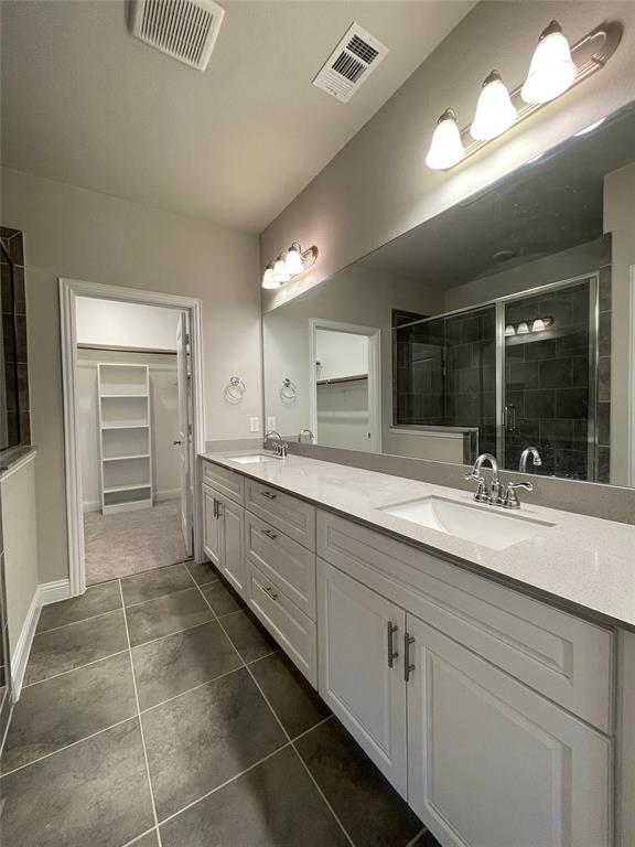 2401 Springhill Avenue Flower Mound, TX 75028 - Photo 20 of 27 a spacious bathroom with a granite countertop sink a mirror and a