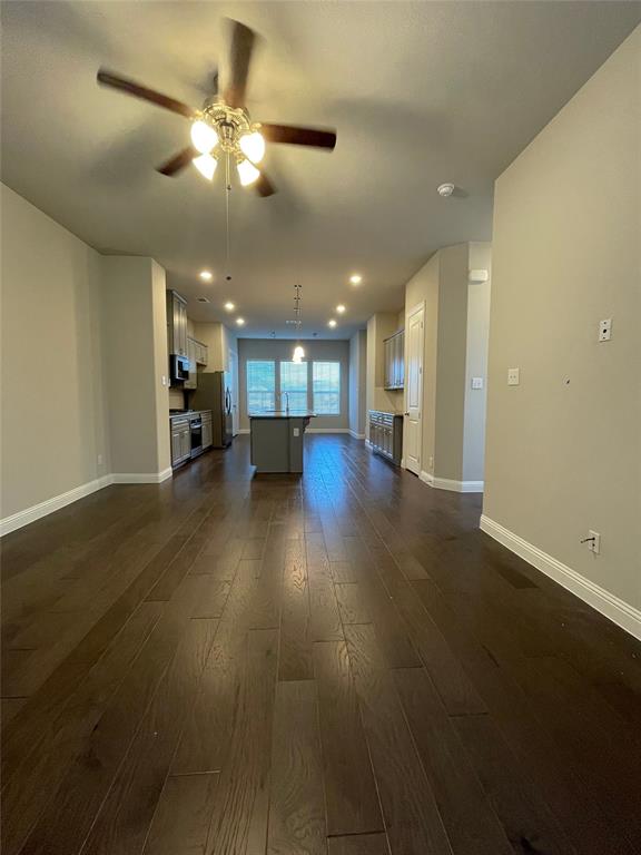 2401 Springhill Avenue Flower Mound, TX 75028 - Photo 4 of 27 an empty room with wooden floor and windows