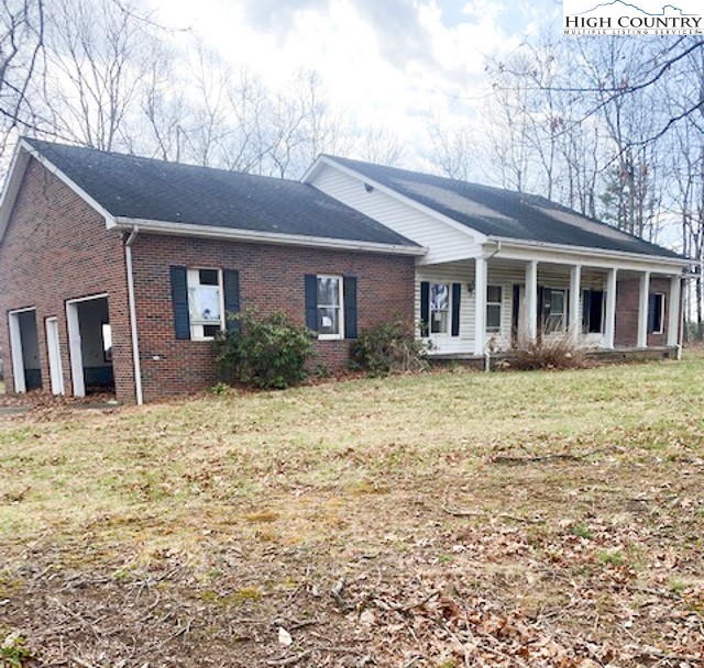 48 Saddle Mountain Church Road Ennice, NC 28623 - Photo 1 of 24 a front view of a house with garden