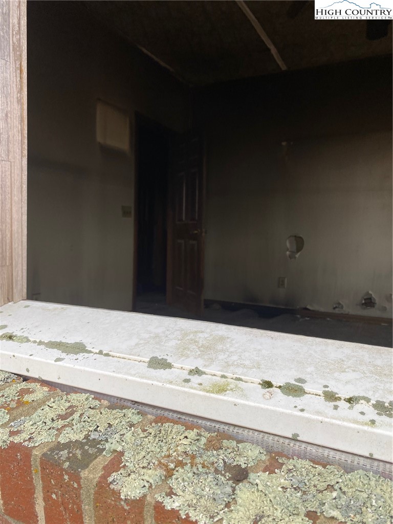 48 Saddle Mountain Church Road Ennice, NC 28623 - Photo 14 of 24 a view of wooden floor and a wooden door