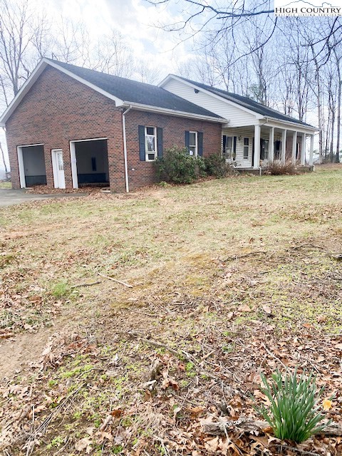 48 Saddle Mountain Church Road Ennice, NC 28623 - Photo 24 of 24 a front view of a house with a yard
