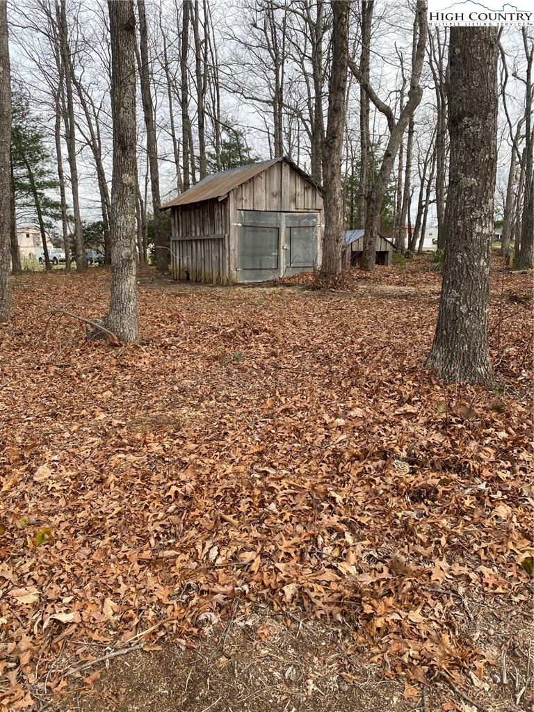 48 Saddle Mountain Church Road Ennice, NC 28623 - Photo 4 of 24 a front view of a house with a yard