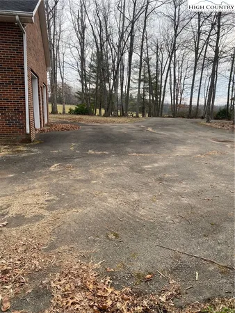 a backyard of a house with trees