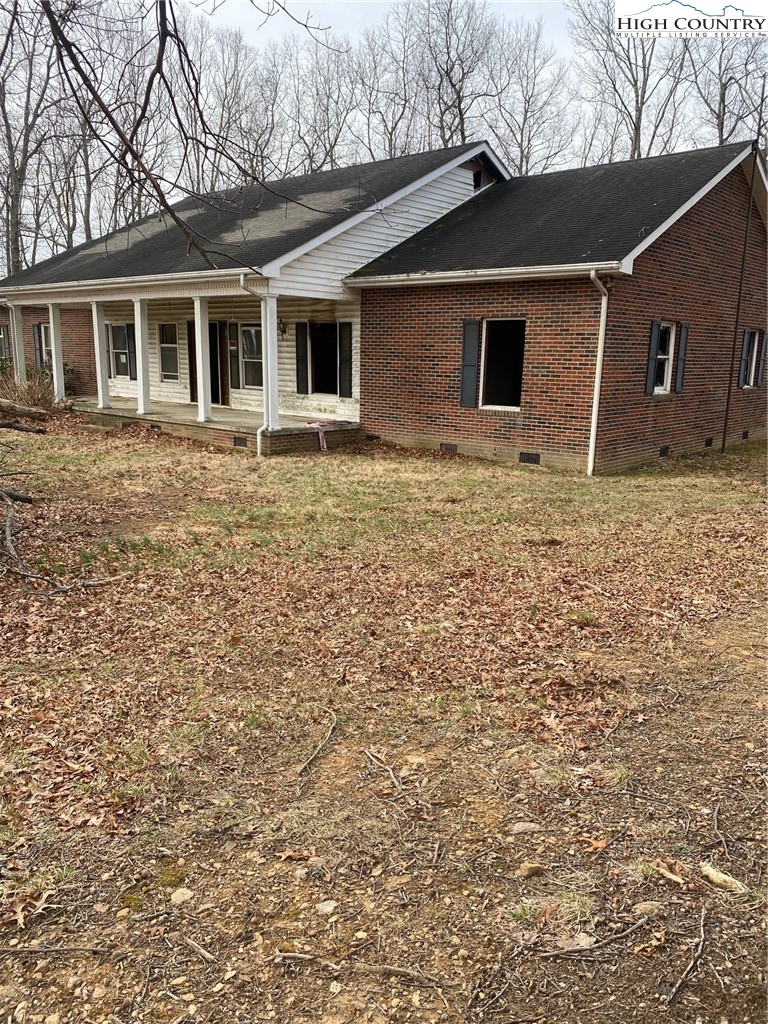 48 Saddle Mountain Church Road Ennice, NC 28623 - Photo 10 of 24 a front view of a house with garden