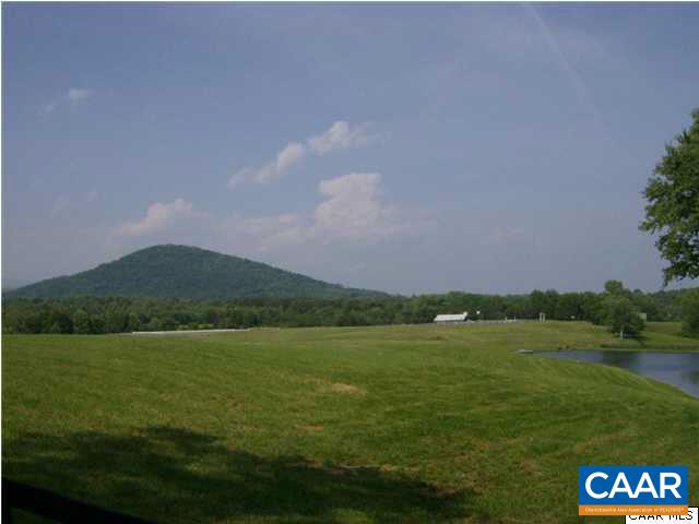 4830 Free Union Road Free Union, VA 22940 - Photo 15 of 17 a view of a lake with a mountain in the background