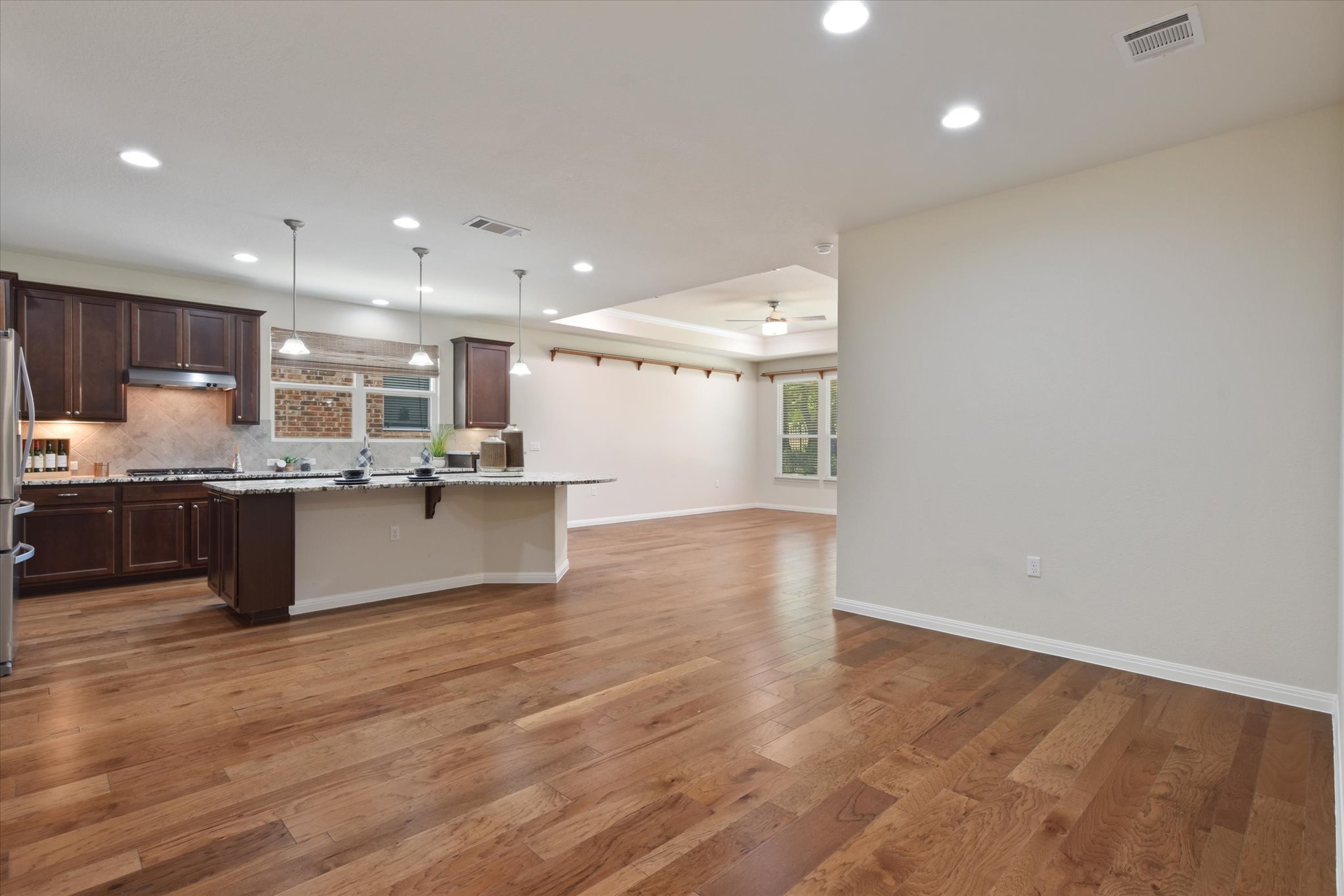 104 Coffee Mill Creek Road Georgetown, TX 78633 - Photo 39 of 40 An open floorplan seamlessly connects the kitchen and living areas.