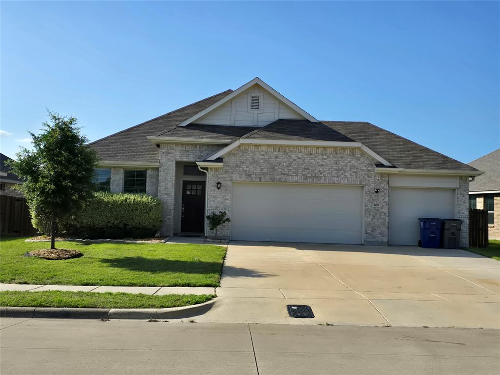 508 Williams Way Van Alstyne, TX 75495 - Photo 1 of 26 a front view of a house with a yard and garage