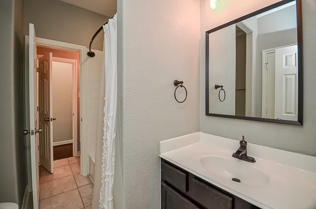a bathroom with a sink and mirror