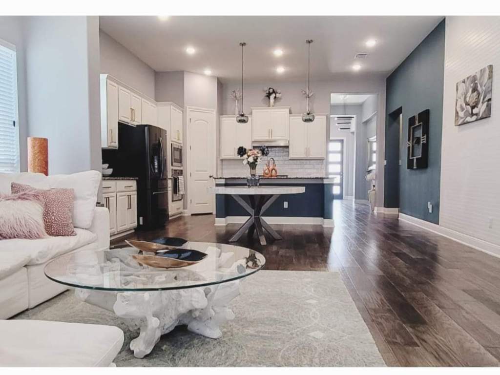 1800 Ficuzza Way Leander, TX 78641 - Photo 1 of 8 Modern Open Concept living area with soaring 12 foot ceilings and dark wood finished floors