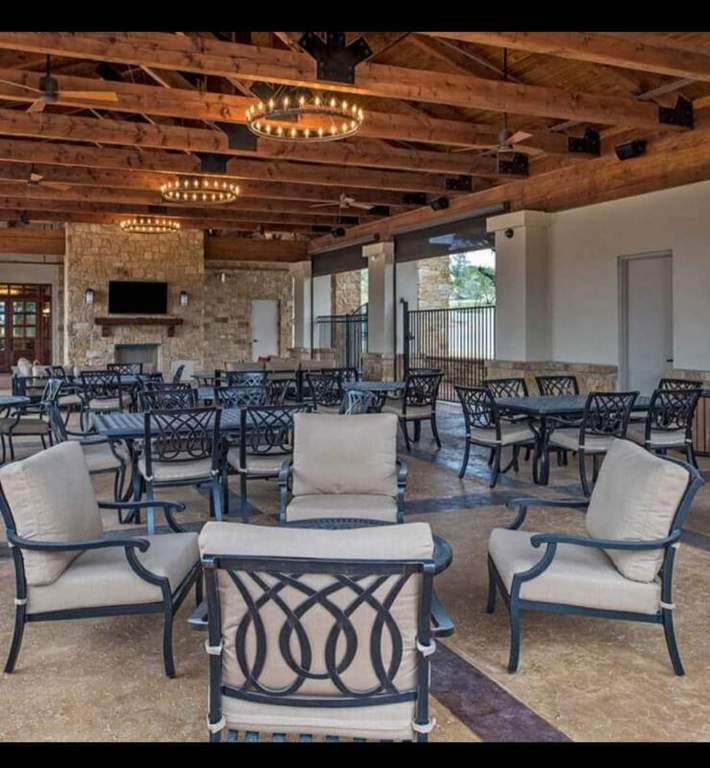 1800 Ficuzza Way Leander, TX 78641 - Photo 8 of 8 View of community patio featuring outdoor dining space and a large fireplace