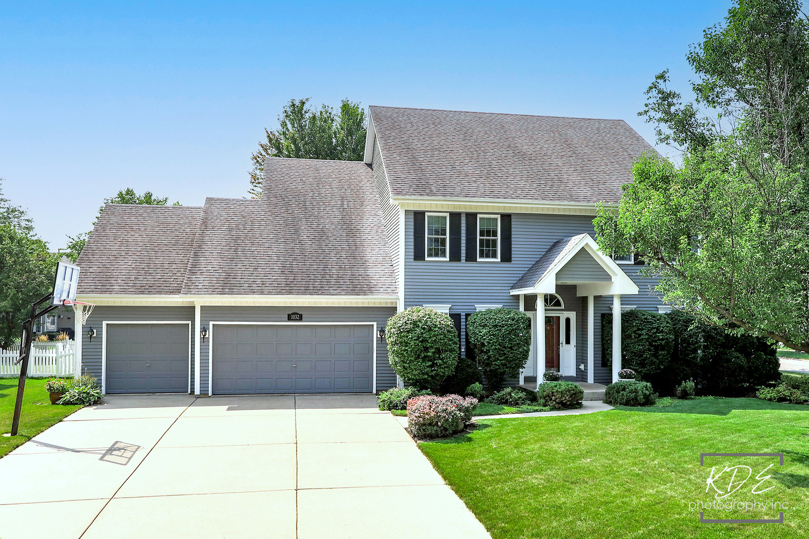 1032 Hamlet Road Naperville, IL 60564 - Photo 2 of 38 a front view of a house with a yard