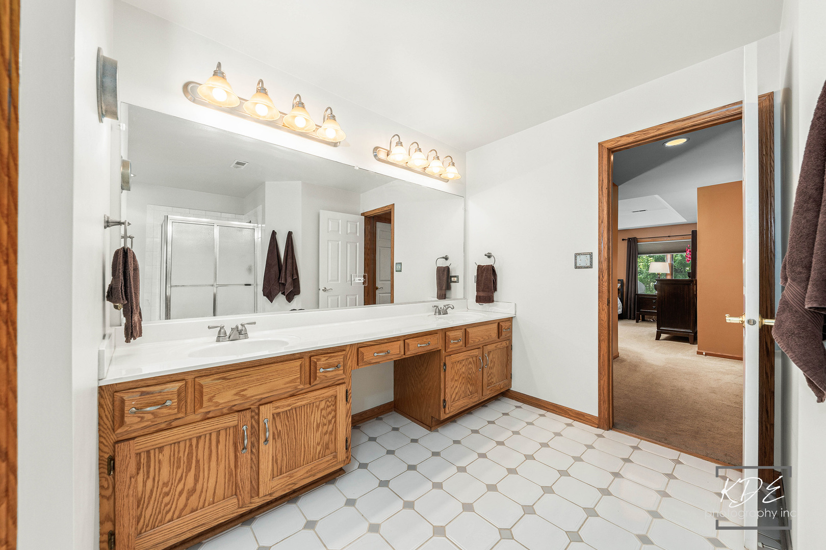 1032 Hamlet Road Naperville, IL 60564 - Photo 24 of 38 a large bathroom with a double vanity sink mirror and