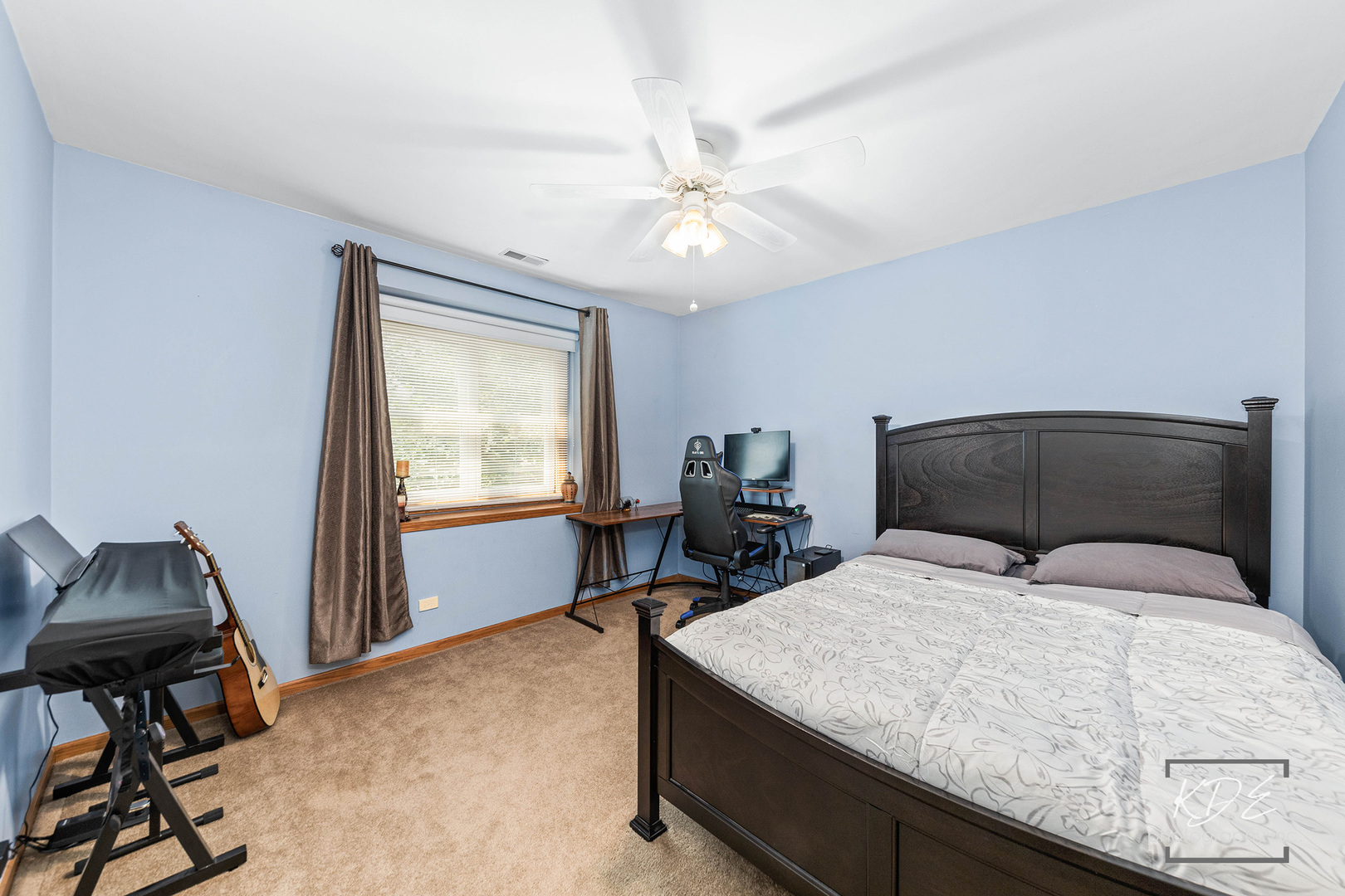 1032 Hamlet Road Naperville, IL 60564 - Photo 27 of 38 a bedroom with a bed and a chandelier