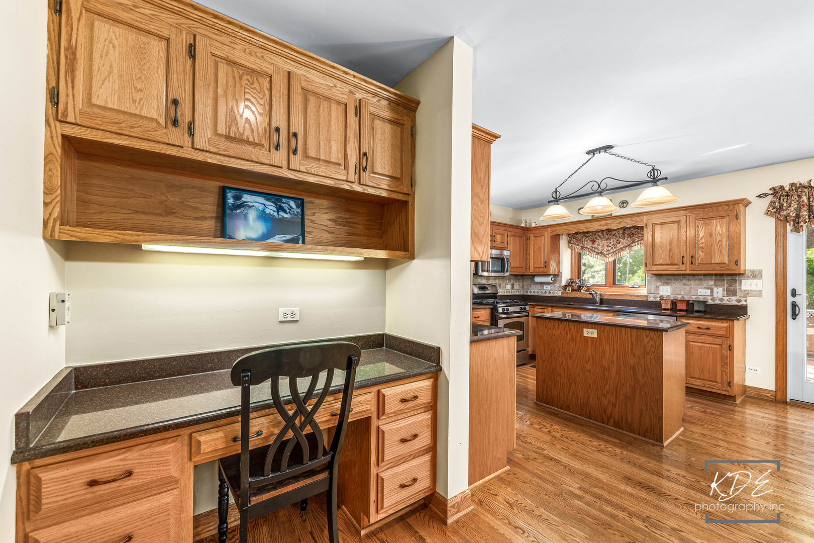 1032 Hamlet Road Naperville, IL 60564 - Photo 9 of 38 a kitchen with stainless steel appliances granite countertop a stove and cabinets