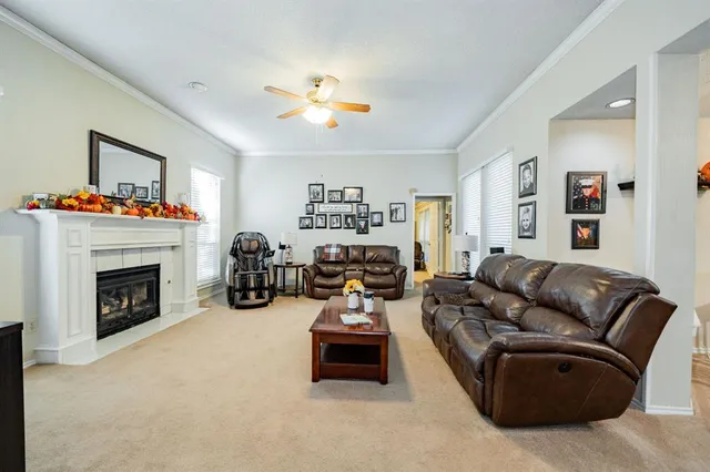 a dining room with furniture a chandelier and a rug