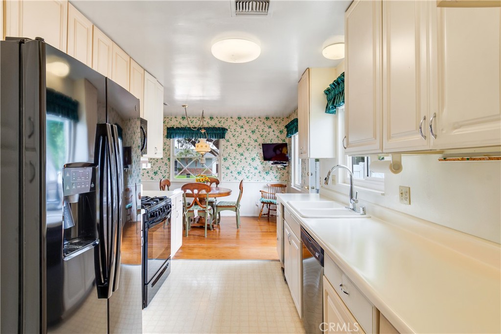 6765 Montclair Drive Riverside, CA 92504 - Photo 12 of 30 a view of a kitchen with furniture and a kitchen
