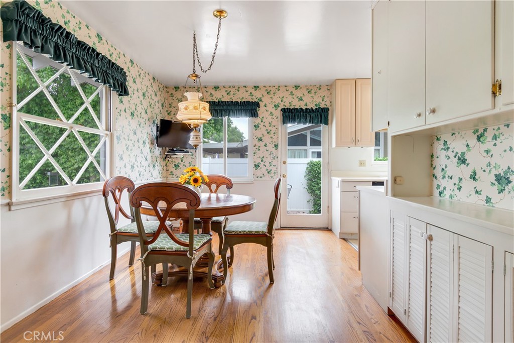 6765 Montclair Drive Riverside, CA 92504 - Photo 13 of 30 a dining room with furniture a fireplace and wooden floor