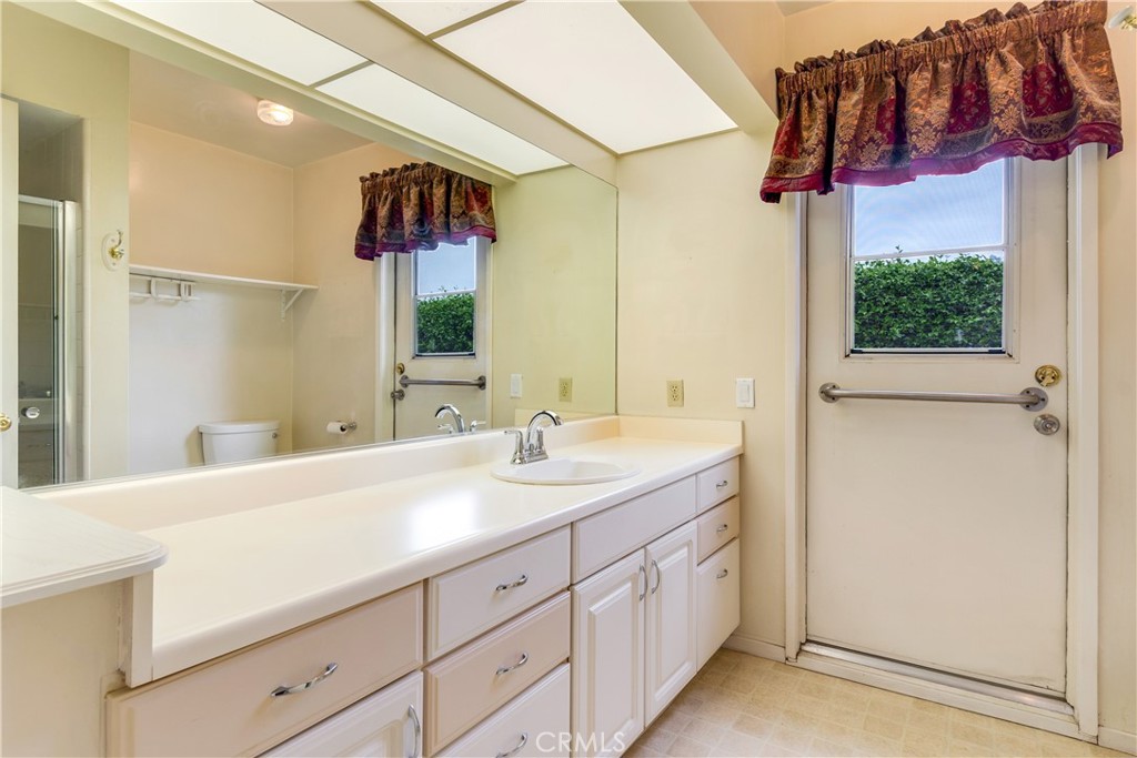 6765 Montclair Drive Riverside, CA 92504 - Photo 17 of 30 a bathroom with a sink and a mirror
