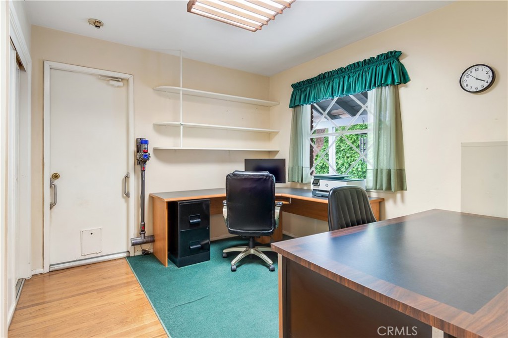 6765 Montclair Drive Riverside, CA 92504 - Photo 20 of 30 a view of a workspace with furniture and a window