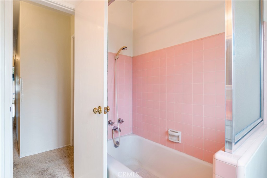 6765 Montclair Drive Riverside, CA 92504 - Photo 21 of 30 a bathroom with a bathtub and shower