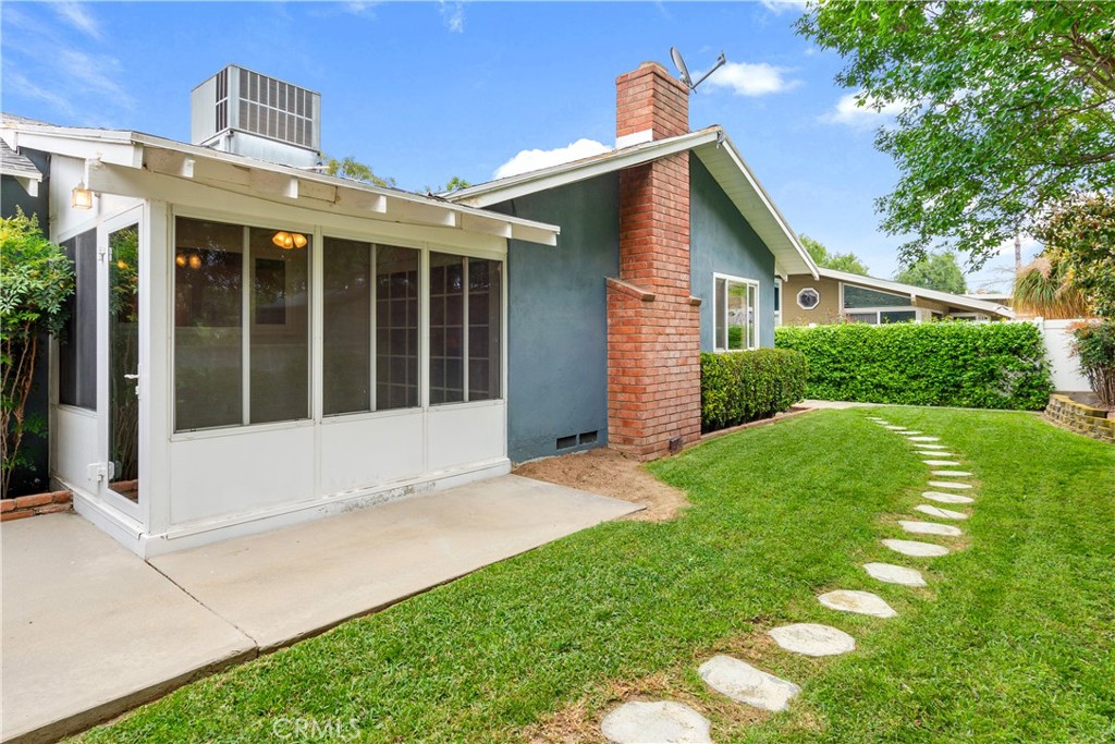 6765 Montclair Drive Riverside, CA 92504 - Photo 24 of 30 a view of an house with backyard space and garden