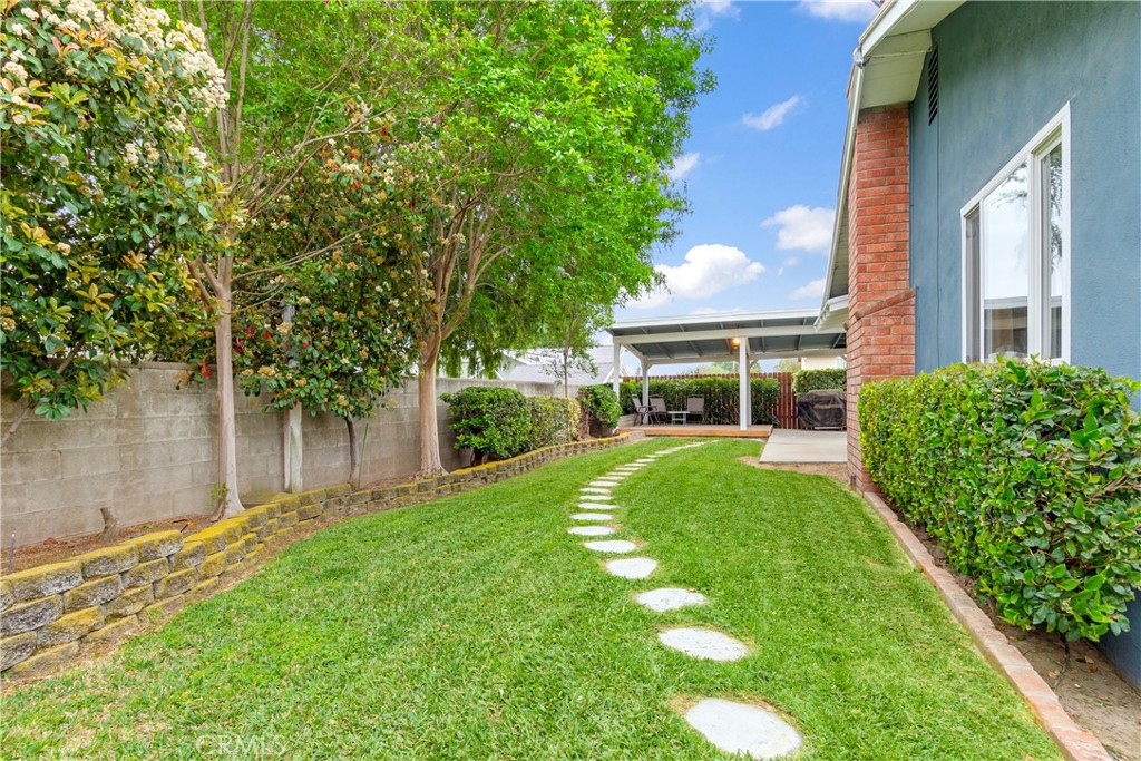 6765 Montclair Drive Riverside, CA 92504 - Photo 27 of 30 a front view of a house with a yard