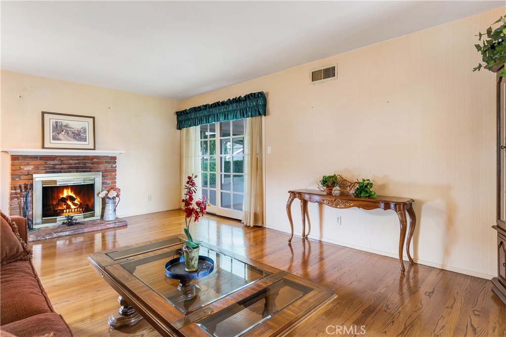 6765 Montclair Drive Riverside, CA 92504 - Photo 5 of 30 a living room with furniture and a fireplace