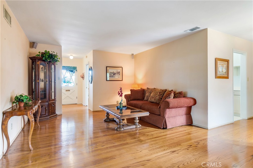 6765 Montclair Drive Riverside, CA 92504 - Photo 7 of 30 a living room with furniture and wooden floor
