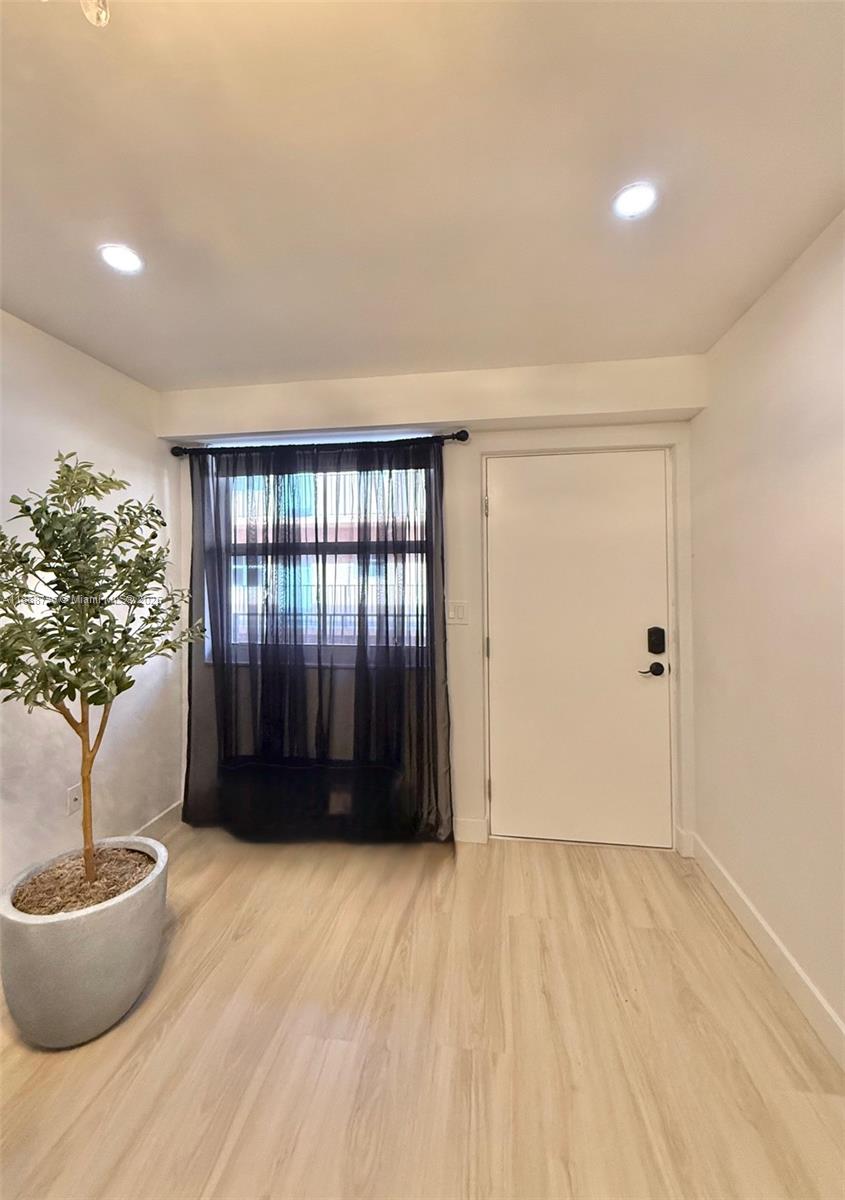 199 Southwest 12th Avenue, Unit 404A Miami, FL 33130 - Photo 12 of 65 a view of an empty room with a window