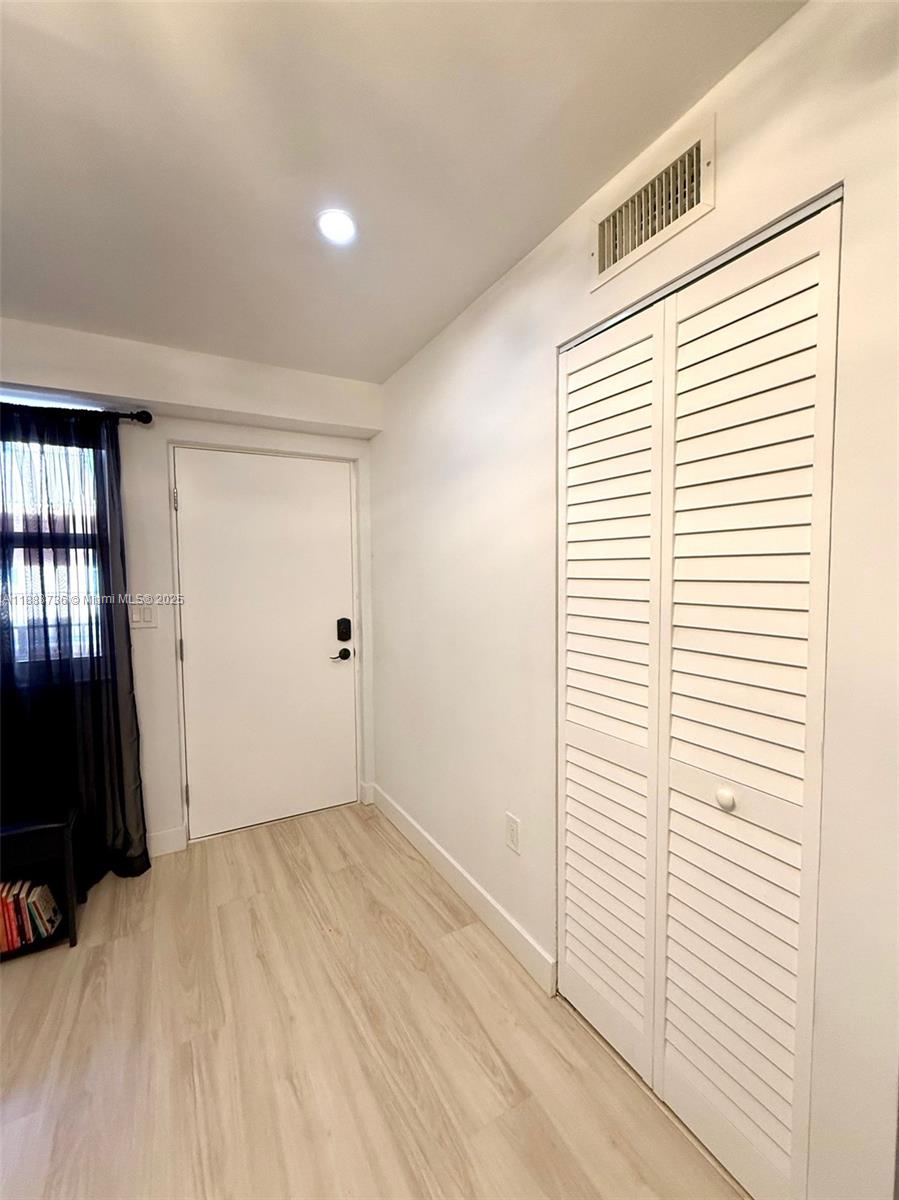 199 Southwest 12th Avenue, Unit 404A Miami, FL 33130 - Photo 13 of 65 an empty room with a window