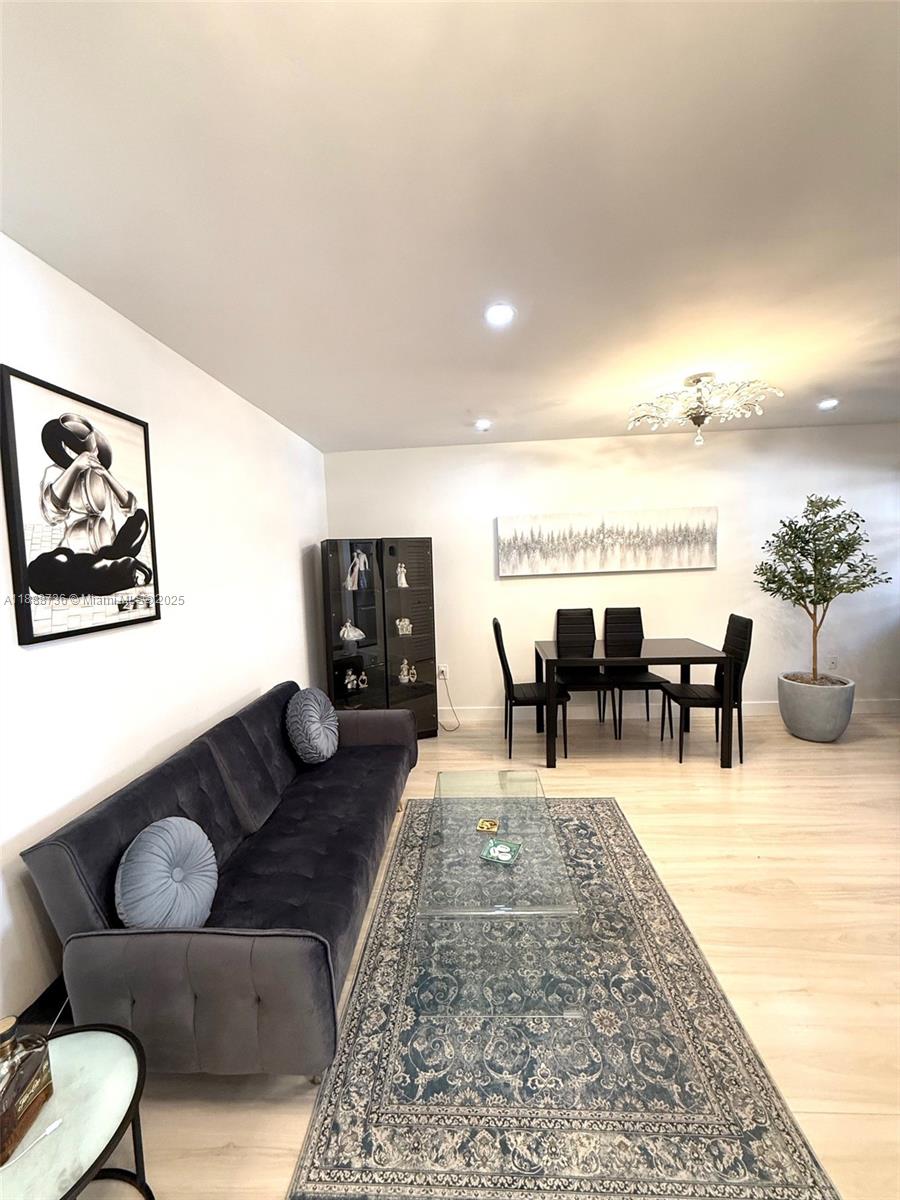 199 Southwest 12th Avenue, Unit 404A Miami, FL 33130 - Photo 14 of 65 a living room with furniture and a table