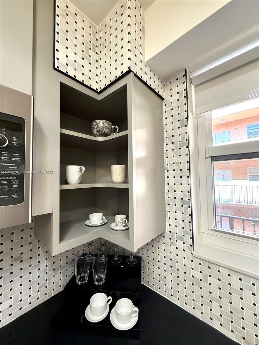 199 Southwest 12th Avenue, Unit 404A Miami, FL 33130 - Photo 25 of 65 a bedroom with a bed and a window