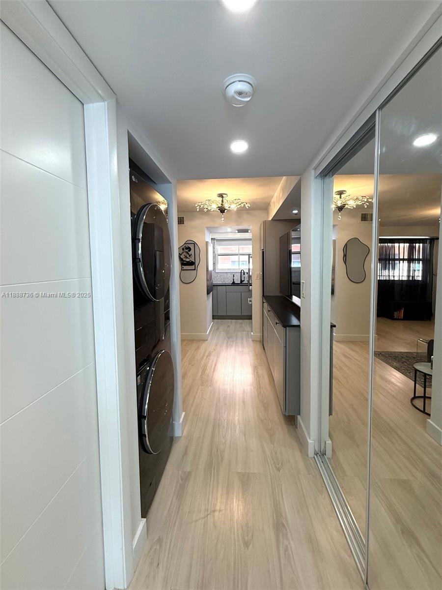 199 Southwest 12th Avenue, Unit 404A Miami, FL 33130 - Photo 29 of 65 a view of a hallway view with wooden floor and furniture