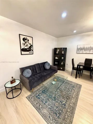 a living room with furniture and a couch