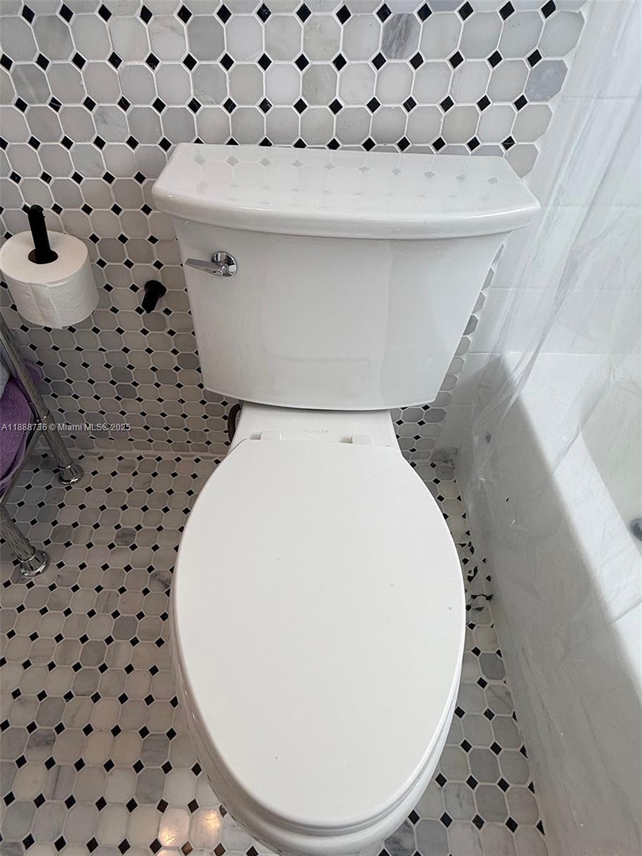 199 Southwest 12th Avenue, Unit 404A Miami, FL 33130 - Photo 33 of 65 a view of a utility room with a fireplace