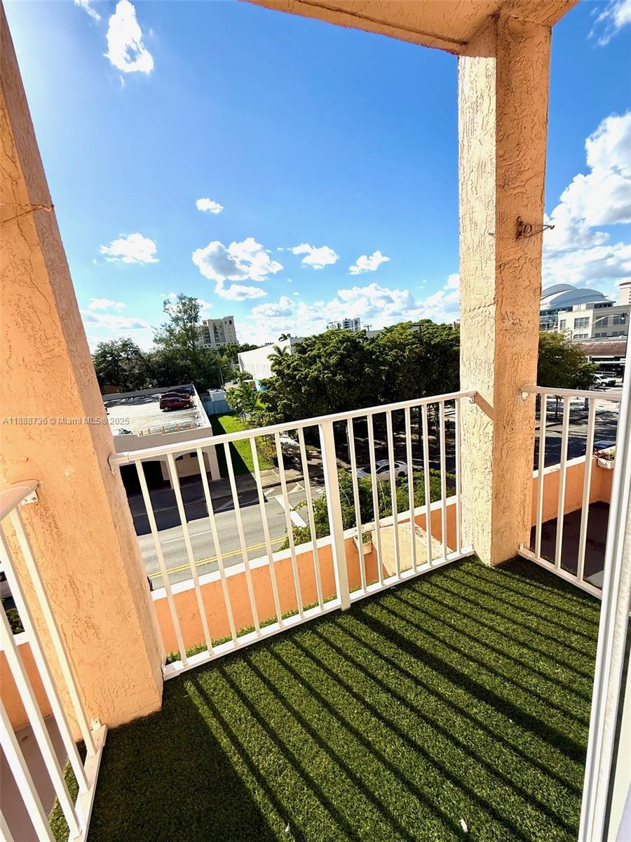 199 Southwest 12th Avenue, Unit 404A Miami, FL 33130 - Photo 40 of 65 a view of a balcony with wooden floor