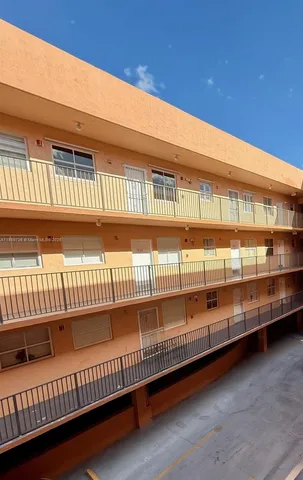 a front view of building with lake view